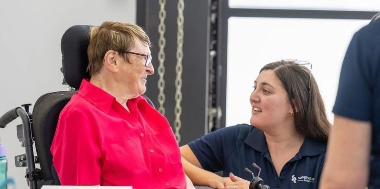 Therapist with older client at home